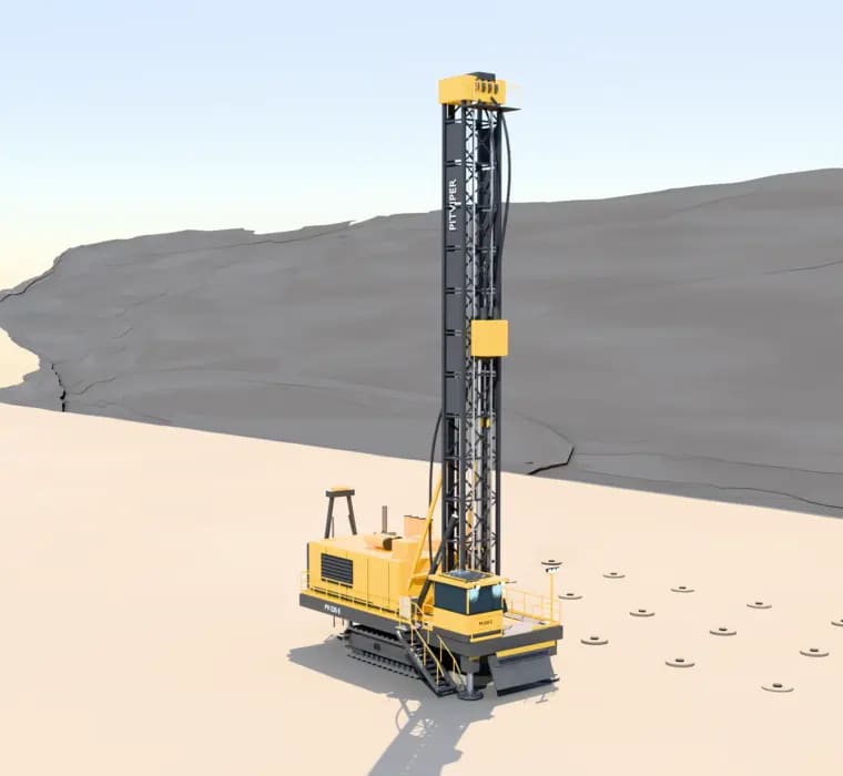 BB9000 drill rig with raised mast at the bench edge, drill pattern in the sand